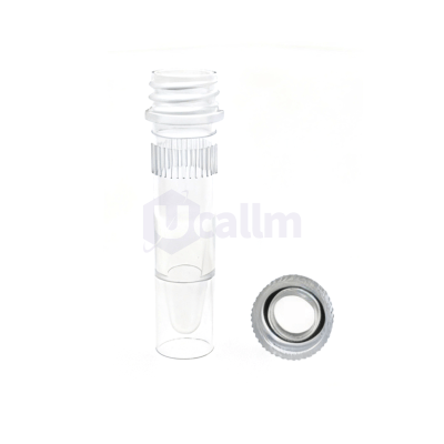 Close-up of a transparent syringe barrel with a detached screw-on cap lying nearby.