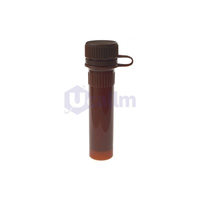 Close-up of a brown glass dropper bottle cap with ribbed edges and a small loop.