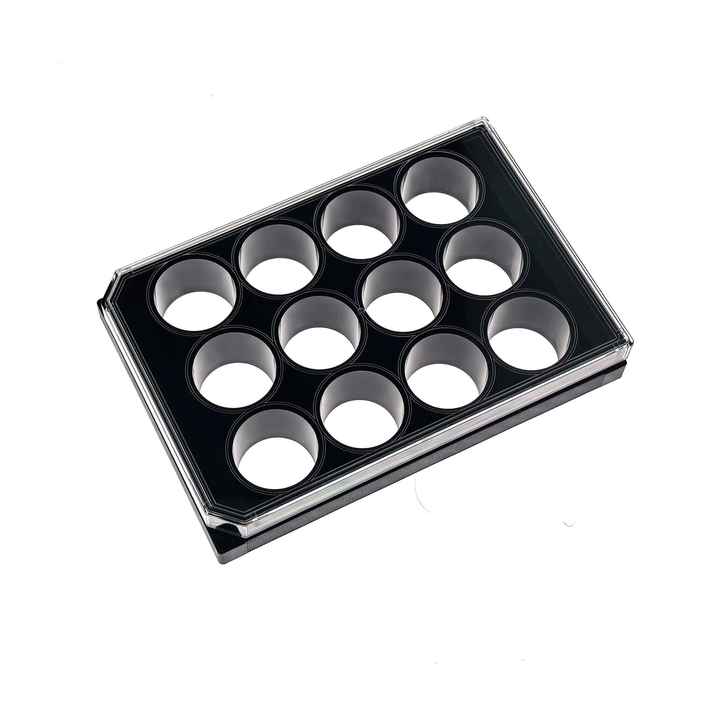 12 Well glass bottom plate (1) Angle view of a black plastic egg tray with circular cavities for eggs against a white background.