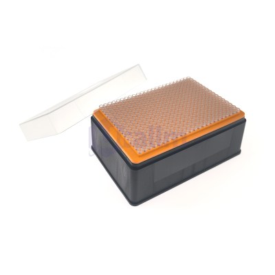 Open 96-well microplate on an orange rack with a clear lid, viewed from an angled side.